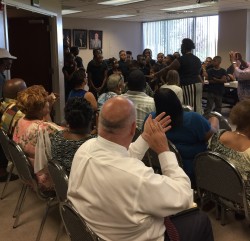 Youth from the Cardinal Village Community choir singing in front of The Housing and Redevelopment Board of Commissioners 